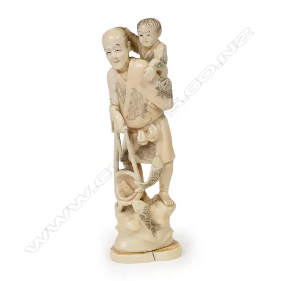A late 19thC marine ivory carved figure group of a fisherman,