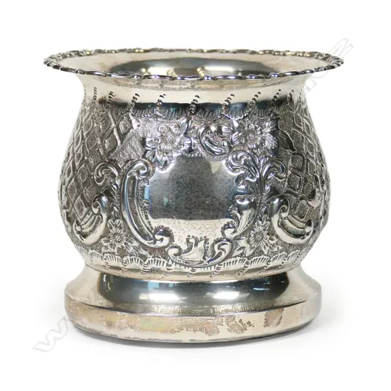 An Edwardian silver bottle coaster,