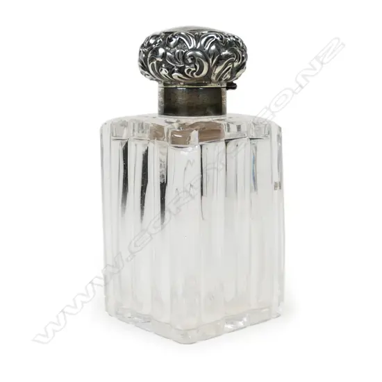 A late 19thC glass bodied silver topped scent bottle,