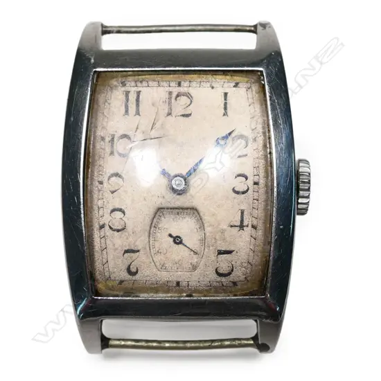 An Art Deco Longines tonneau shaped wristwatch,