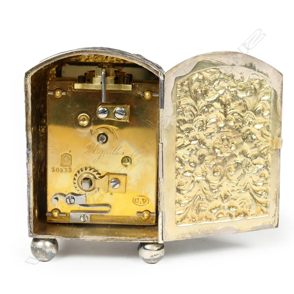 A Victorian embossed silver miniature clock for Asprey of London, Image 1++