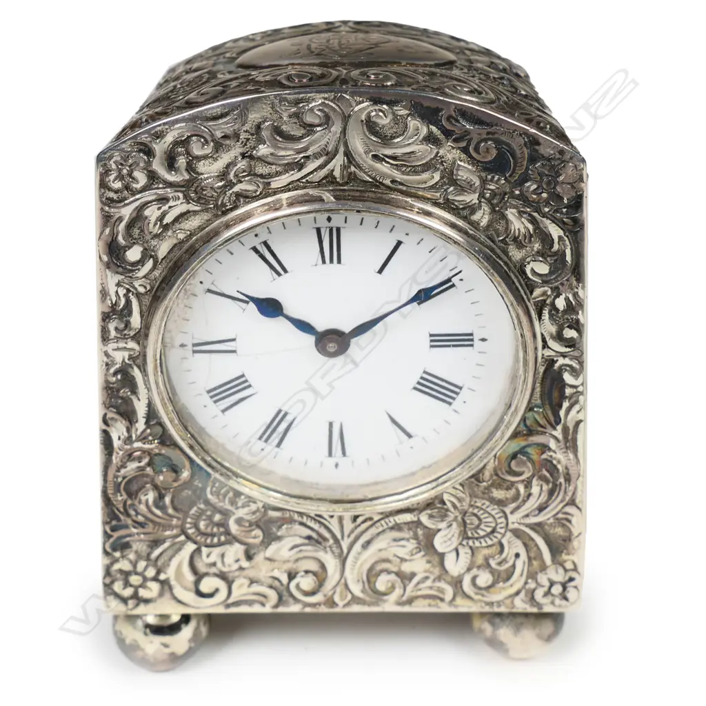 A Victorian embossed silver miniature clock for Asprey of London, Image 1++