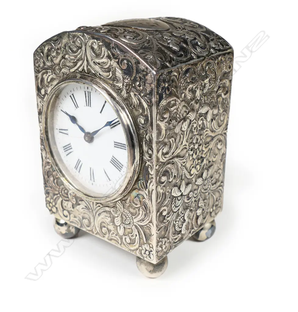 A Victorian embossed silver miniature clock for Asprey of London, Image 1++