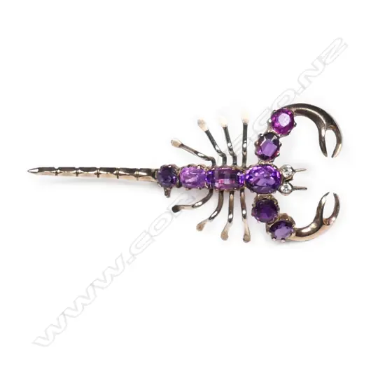 A vintage 9ct rose gold  and amethyst scorpion brooch,