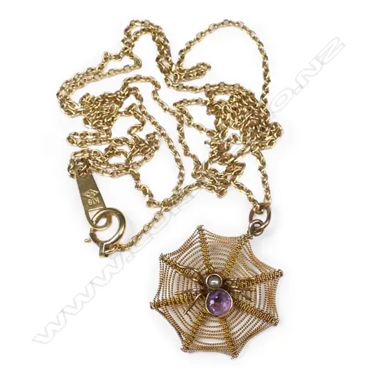 A vintage 9ct gold, amethyst and pearl spider and web pendant,