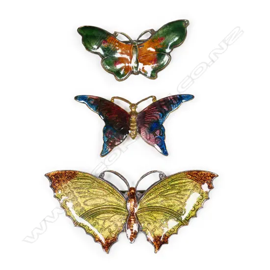 Three vintage base metal and enamel butterfly brooches,