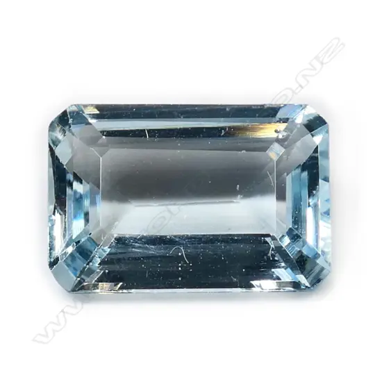 A loose aquamarine gemstone,