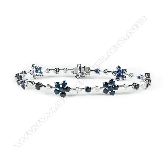 A 14ct white gold, sapphire and diamond floral design bracelet,