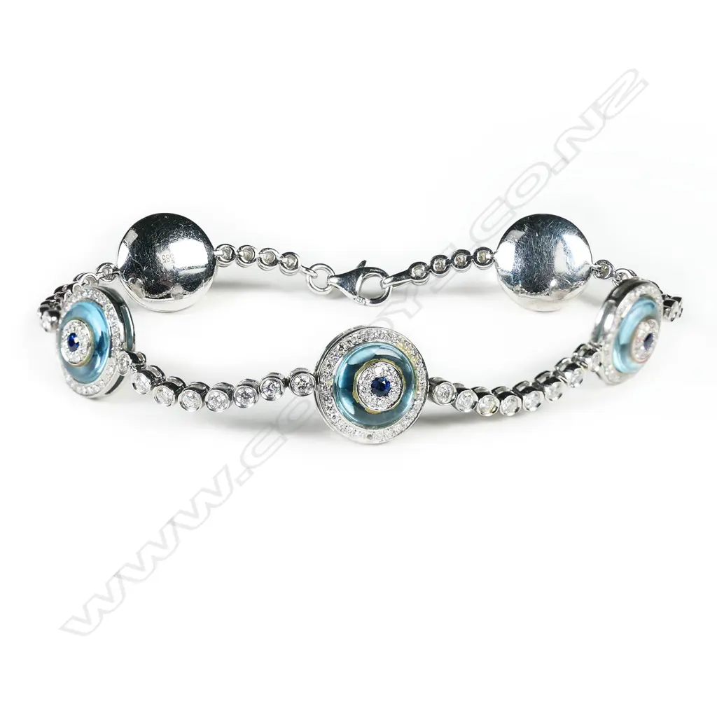 A 14ct white gold, diamond, sapphire and blue topaz bracelet, Image 1++