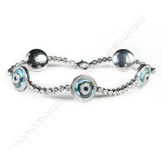 A 14ct white gold, diamond, sapphire and blue topaz bracelet,