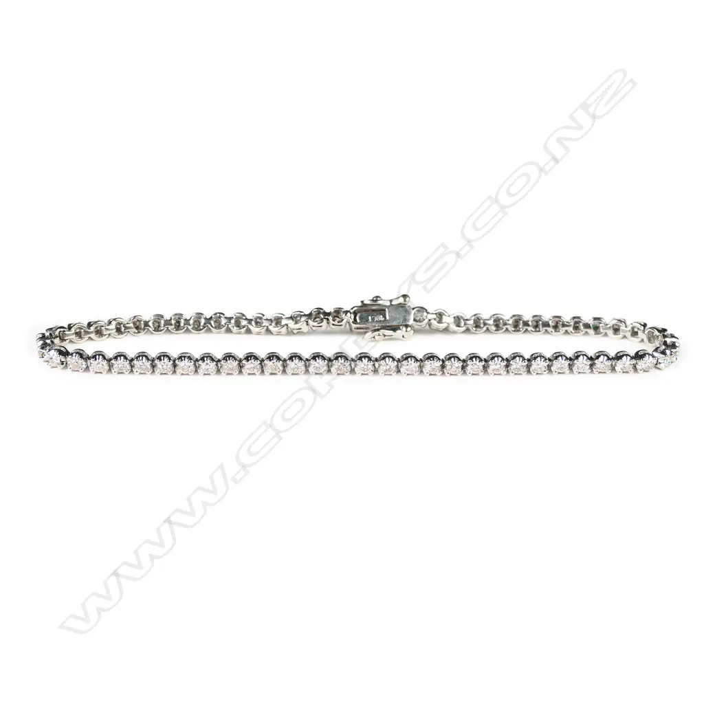 An 18ct white gold and diamond tennis bracelet, Image 1++