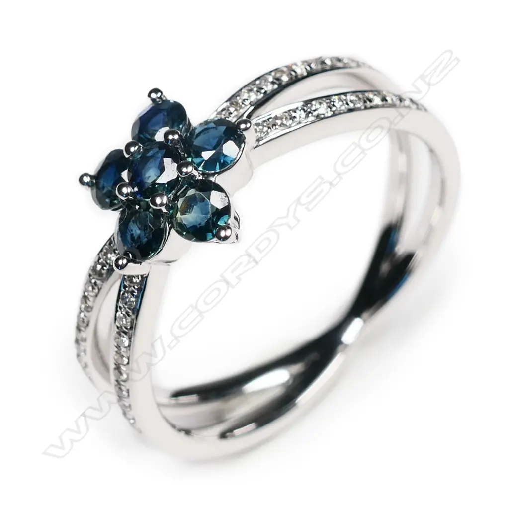 A 14ct white gold, sapphire and diamond flower design ring, Image 1++