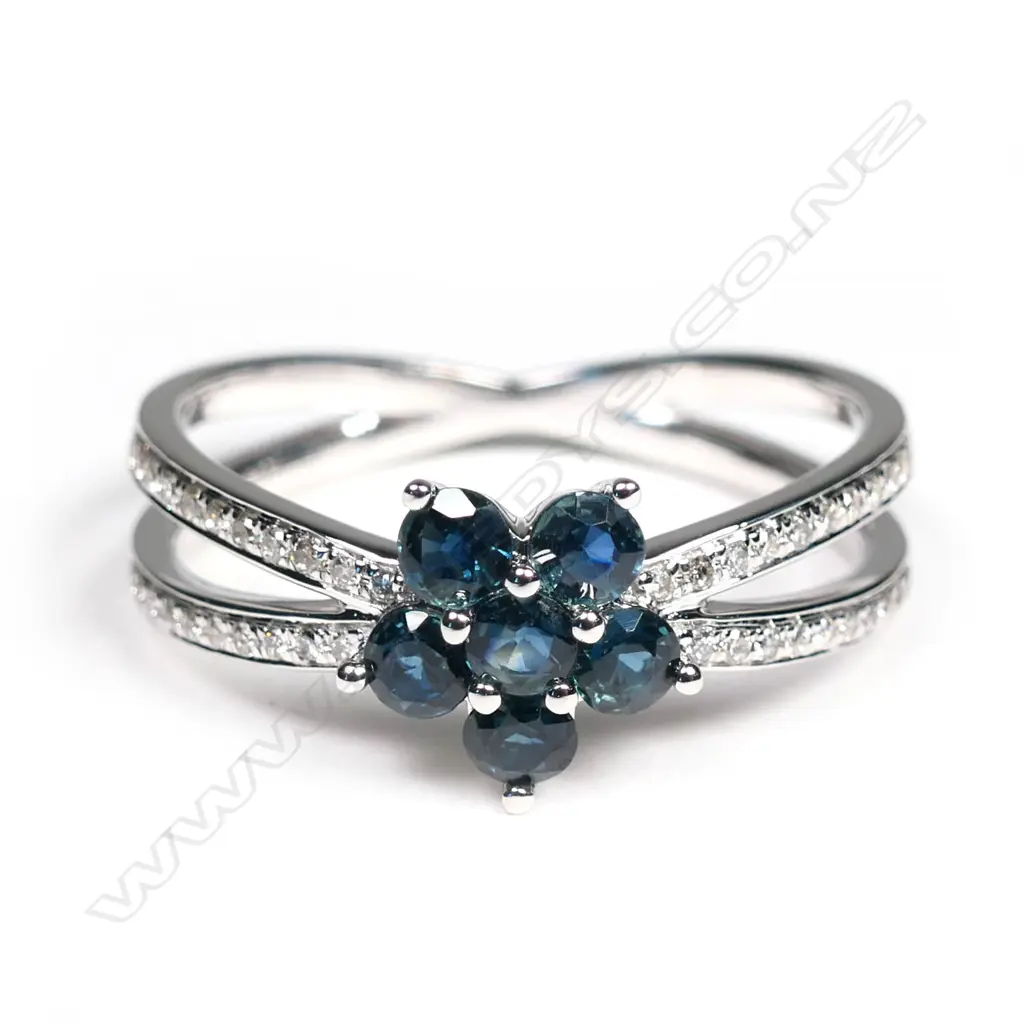 A 14ct white gold, sapphire and diamond flower design ring, Image 1++
