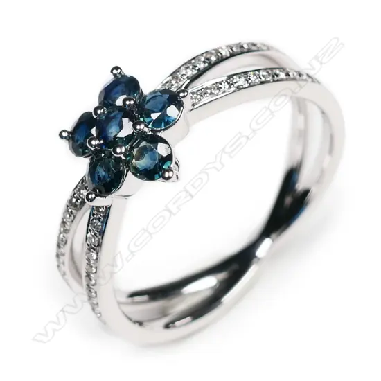 A 14ct white gold, sapphire and diamond flower design ring,