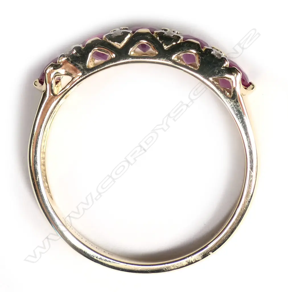 A 14ct gold ruby and diamond set eternity ring, Image 1++