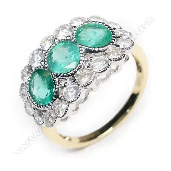 A 14ct gold, emerald and diamond trilogy ring,