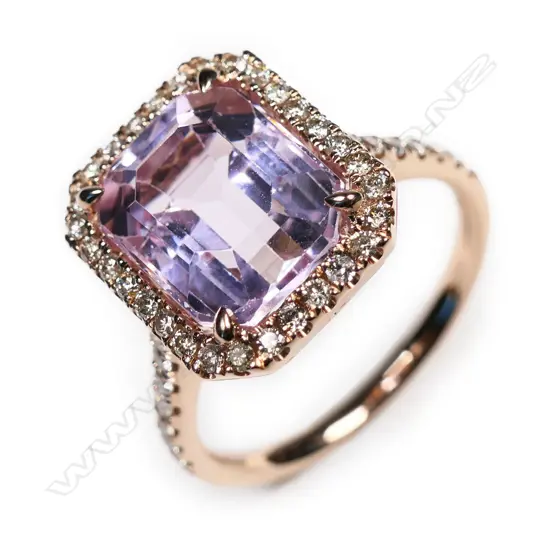 A 14ct rose gold, kunzite and diamond halo ring,