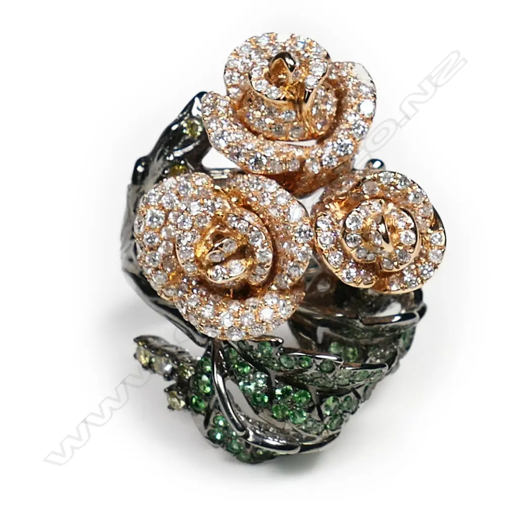 An impressive 18ct rose, white and black gold diamond and tsavorite garnet dress ring, Image 1++