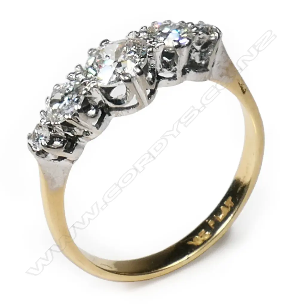 A platinum and yellow gold multi diamond ring, Image 1++