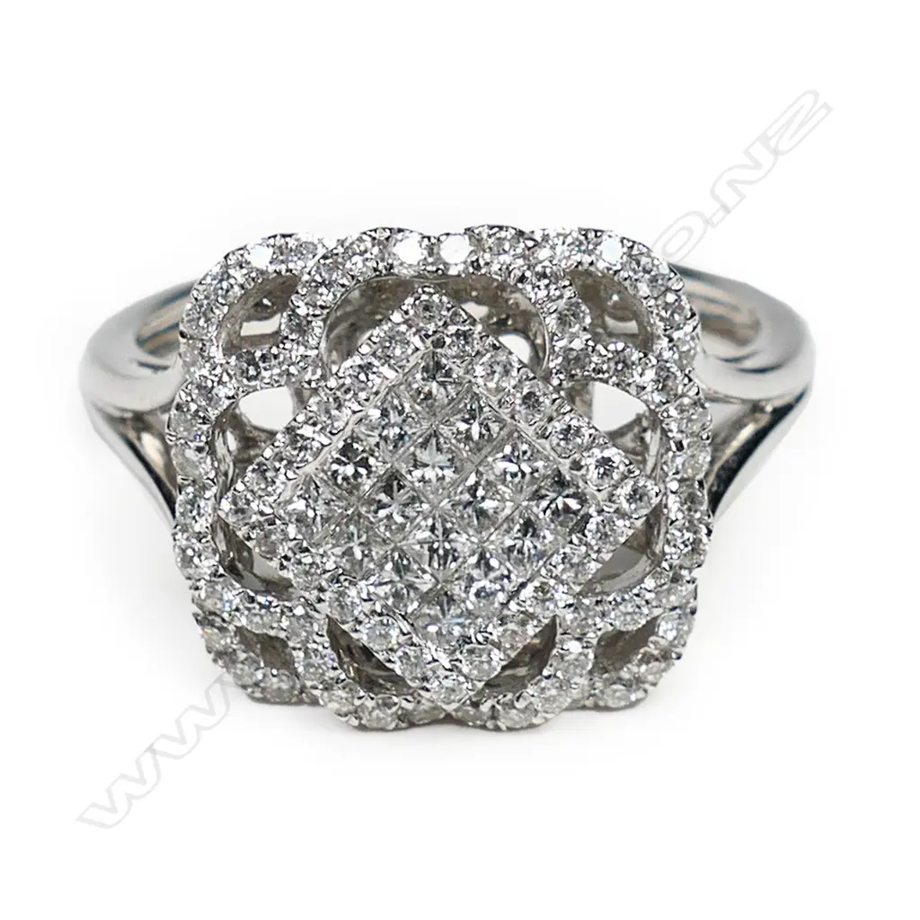 An 18ct white gold and diamond cluster ring, Image 1++