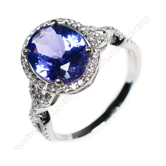 An 18ct white gold, tanzanite and diamond ring,