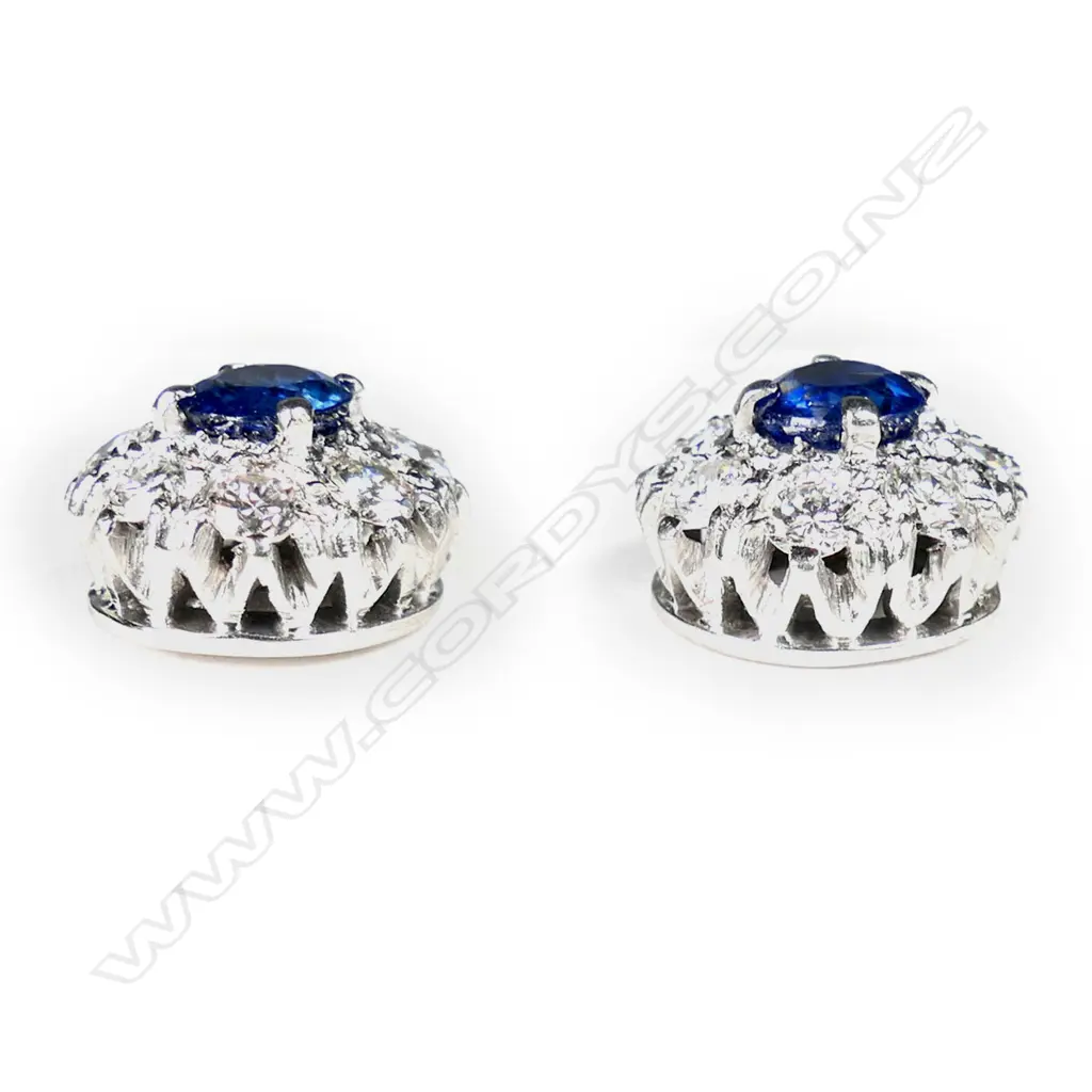 A pair of platinum and 18ct white gold, sapphire and diamond stud earrings, Image 1++
