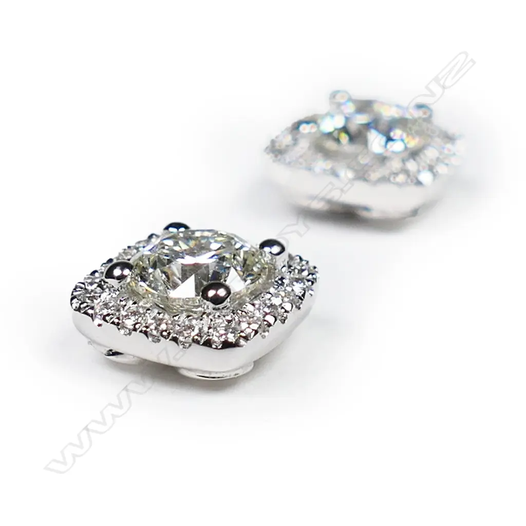 A pair of 18ct white gold and diamond halo stud earrings, Image 1++