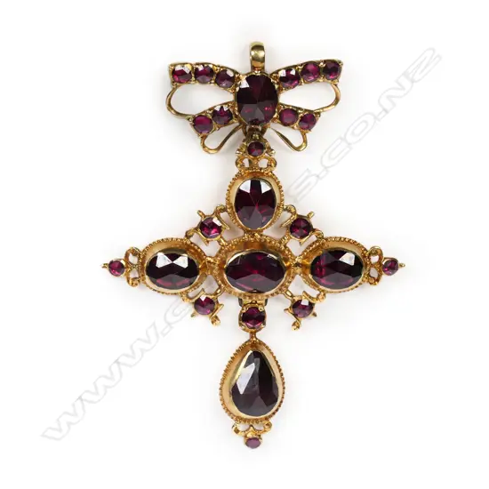 An ornate Victorian 18ct gold and almandine garnet cross pendant,