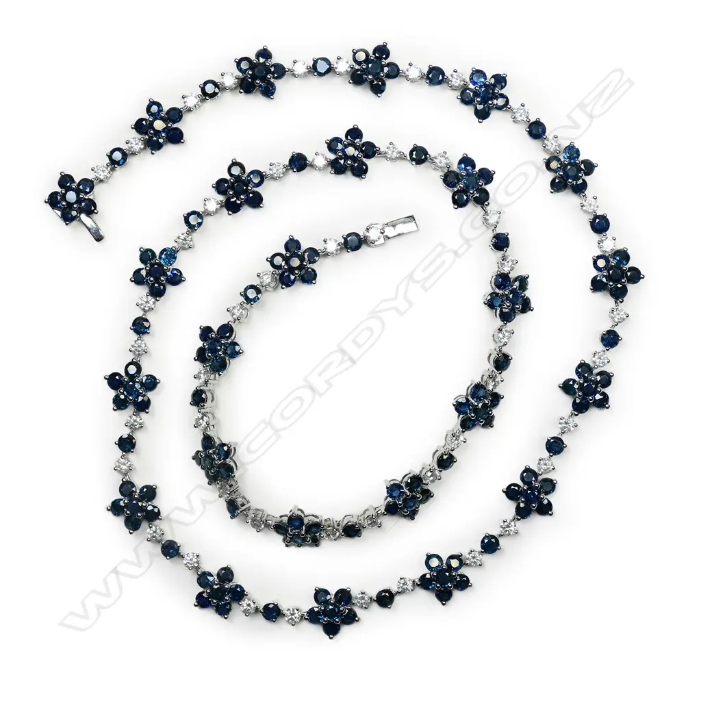 A 14ct white gold, sapphire and diamond floral design necklace, Image 1++
