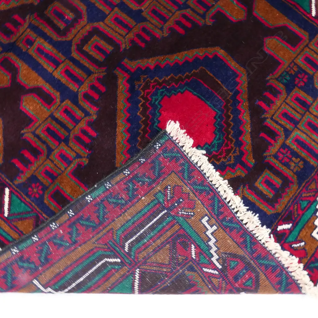 A hand knotted wool pile tribal Balouchi rug, Image 1++