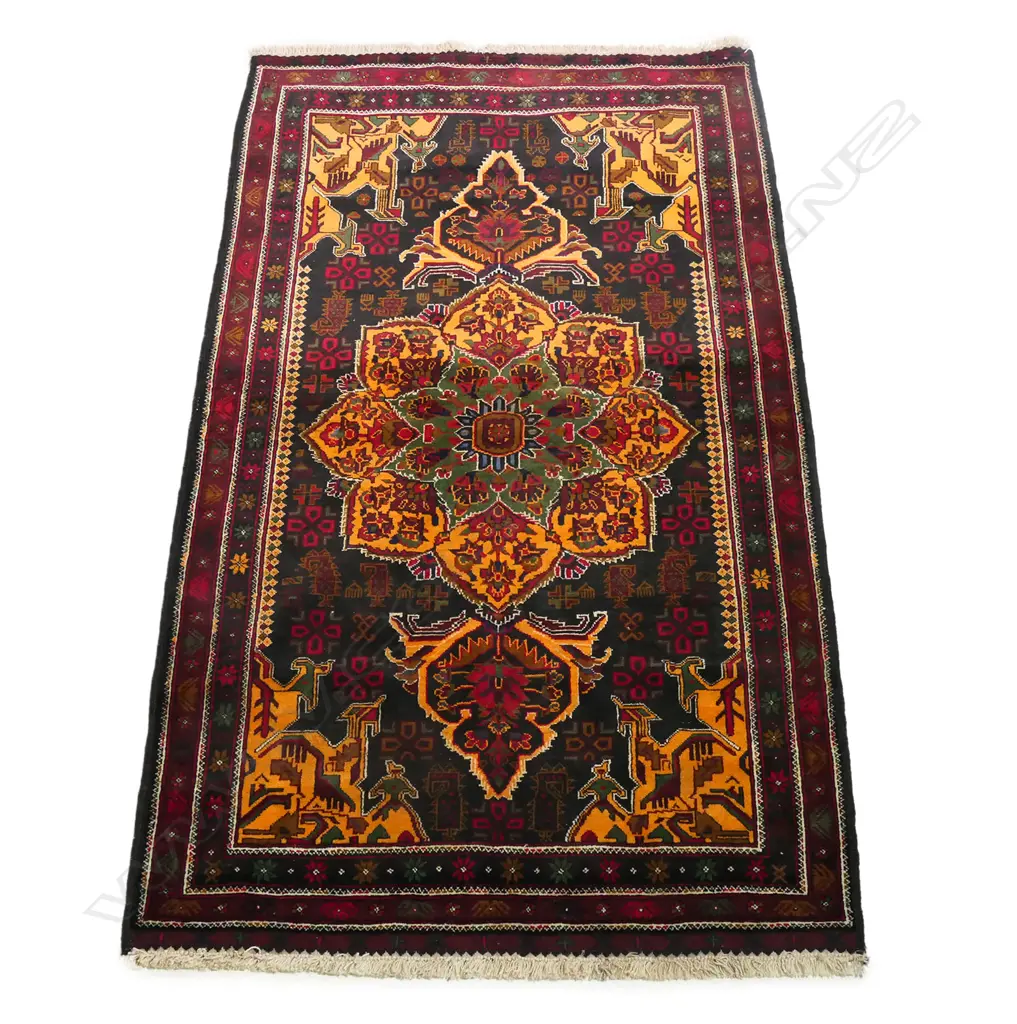 A hand knotted tribal Balouchi rug, Image 1++