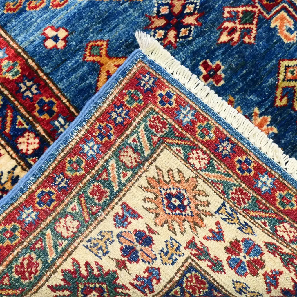 A hand knotted wool pile Kazak rug, Image 1++