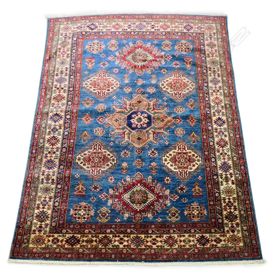 A hand knotted wool pile Kazak rug,