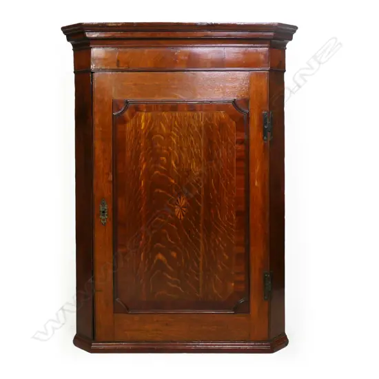 A George III oak hanging corner cabinet,
