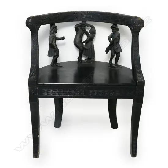A 19thC European carved and ebonised figure back chair,