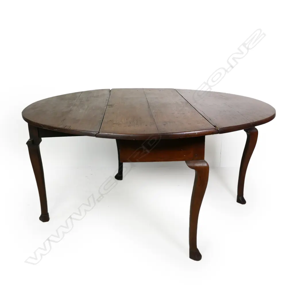 A George III oak oval drop leaf table, Image 1++