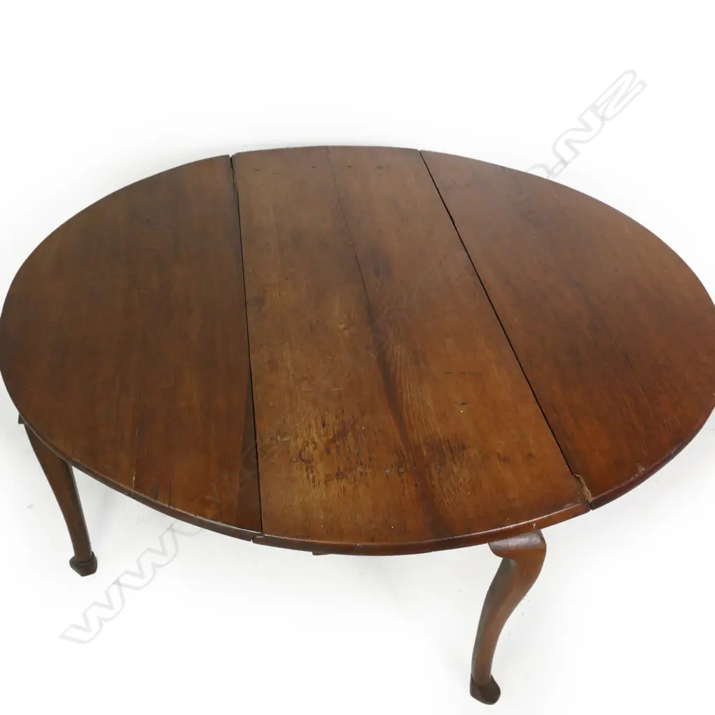 A George III oak oval drop leaf table, Image 1++