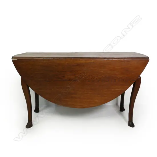 A George III oak oval drop leaf table,