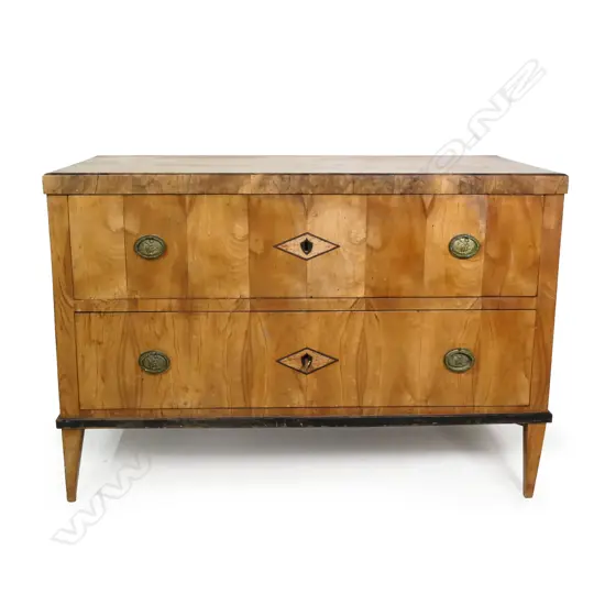 A 19thC Biedermeier birch two drawer commode,