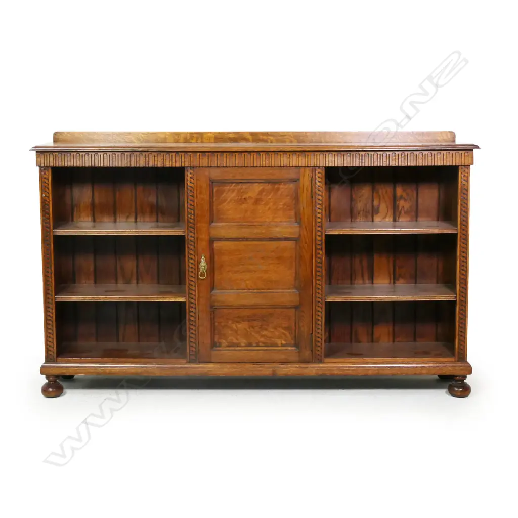 An early 20thC oak carved bookcase, Image 1++