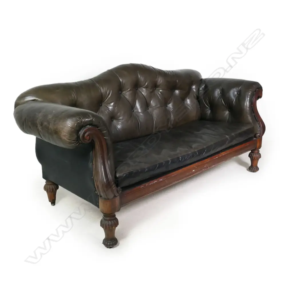 An early Victorian mahogany framed button back leather settee, Image 1++