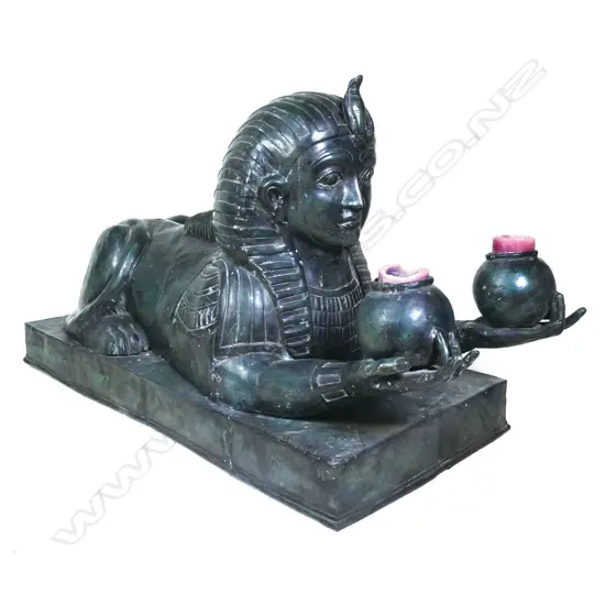 An impressive large 20thC bronze sphinx sculpture,