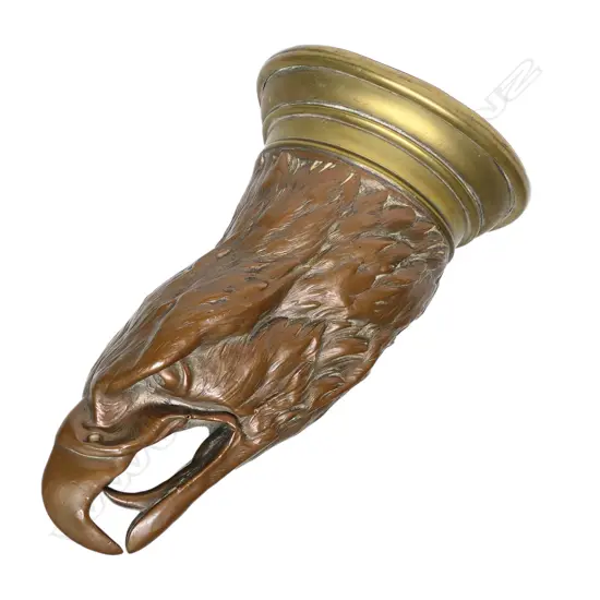 A large copper and brass eagle's head stirrup cup,