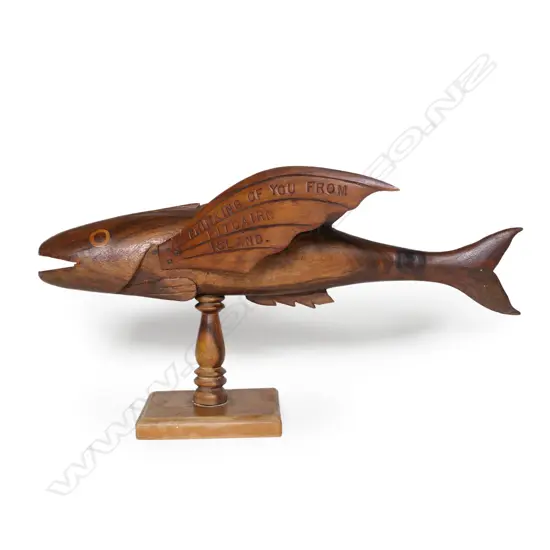 A vintage Pitcairn Island carved wood flying fish,