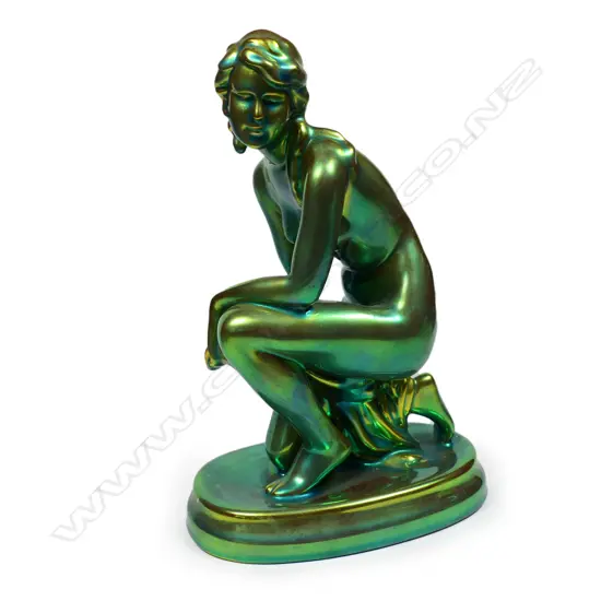 A Hungarian Zsolnay iridescent green glazed naked woman figure,