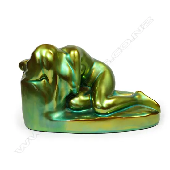 A Hungarian Zsolnay iridescent green glazed naked woman figure,
