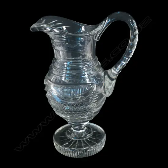 A heavy early cut crystal jug,