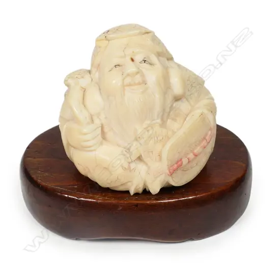 A Japanese ivory okimono of Hotei,