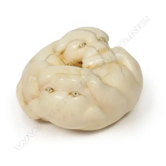 A Japanese ivory netsuke of two puppies,
