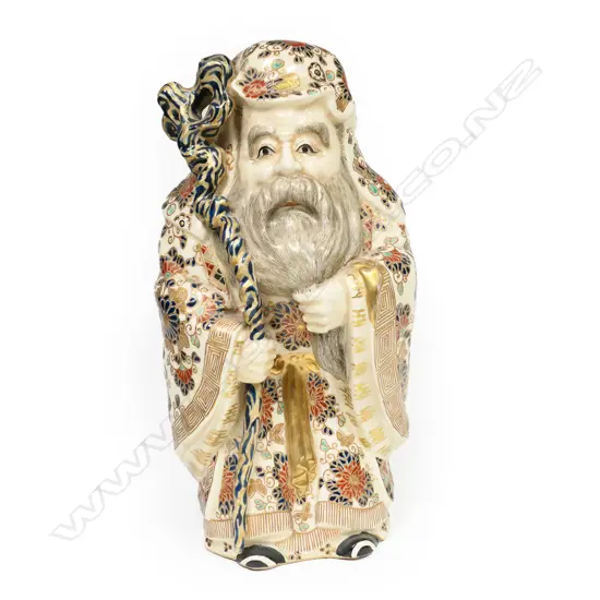 A Satsuma earthenware statue of Jurojin,